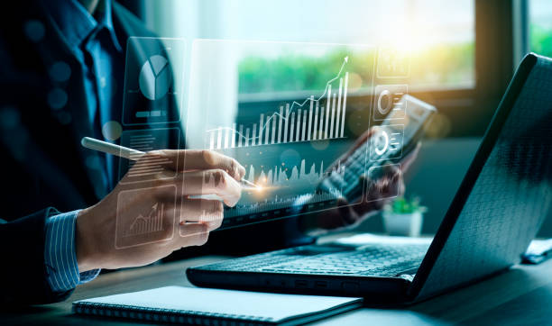 A professional using digital tools to analyse data, symbolising how Klea’s Zapier integration automates workflows and enhances efficiency in legal entity management.