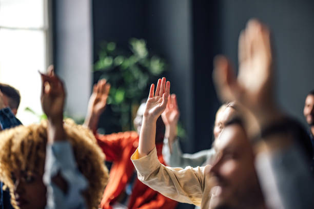 Shareholders voting at an Annual General Meeting in Malaysia, illustrating compliance, transparency, and governance under the Companies Act 2016.
