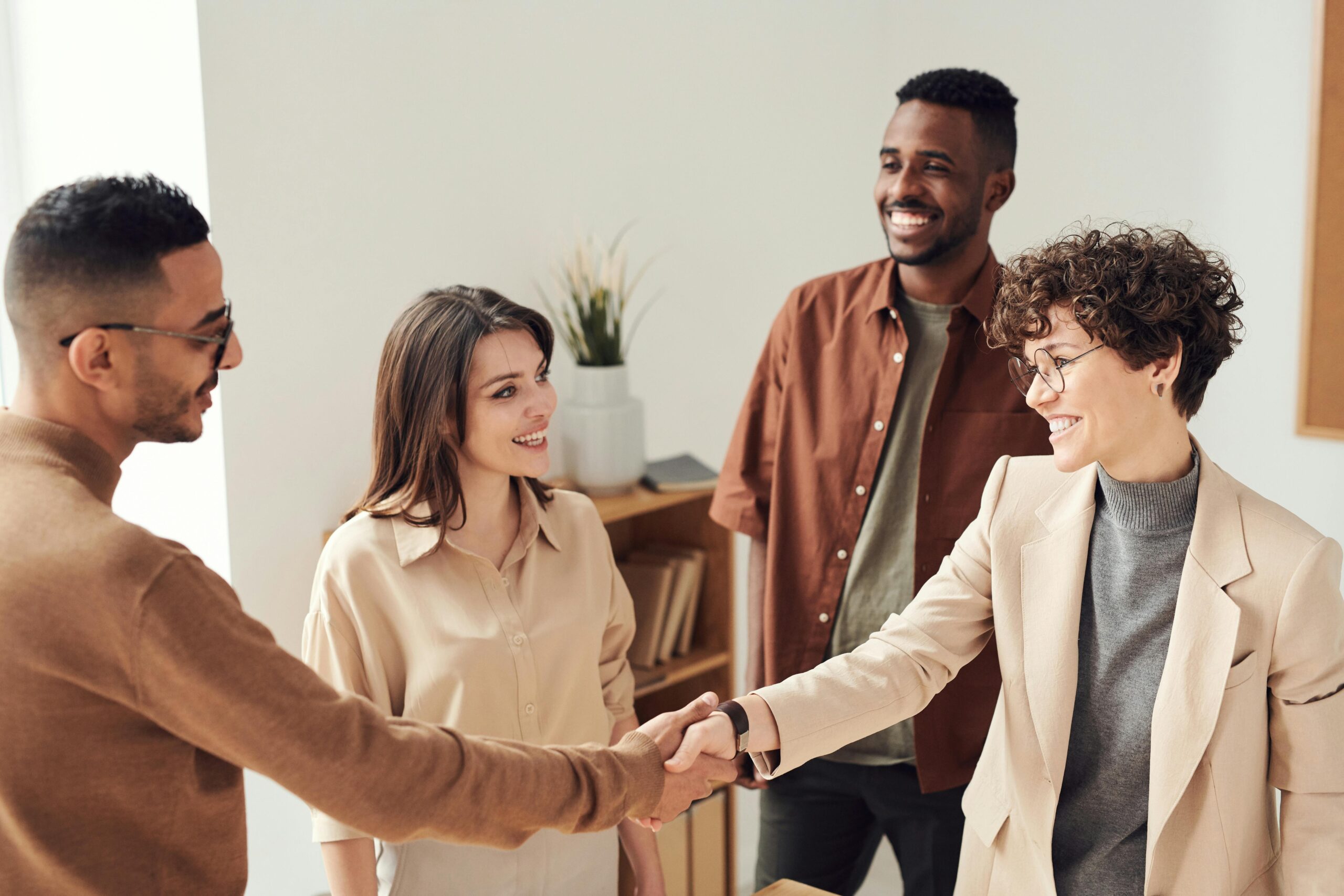 Business professionals celebrating a successful director appointment in Finland, illustrating smooth leadership transitions under the Finnish Companies Act.