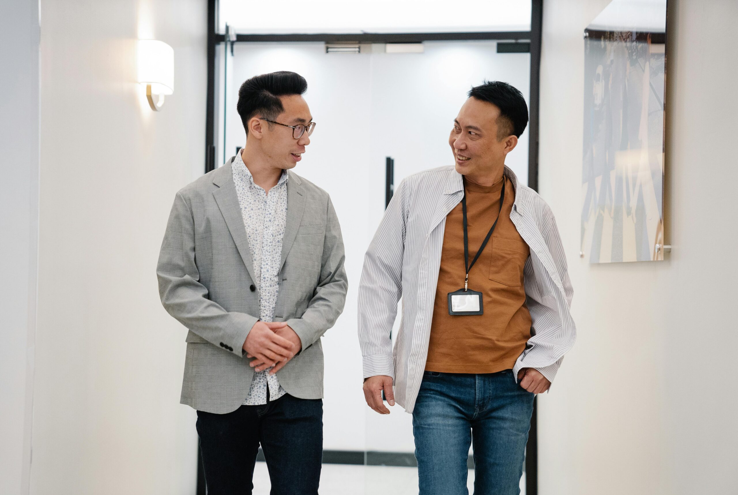 Two business professionals reviewing documents together in a bright, modern office—capturing the collaborative and compliant approach needed for a smooth director change in China.