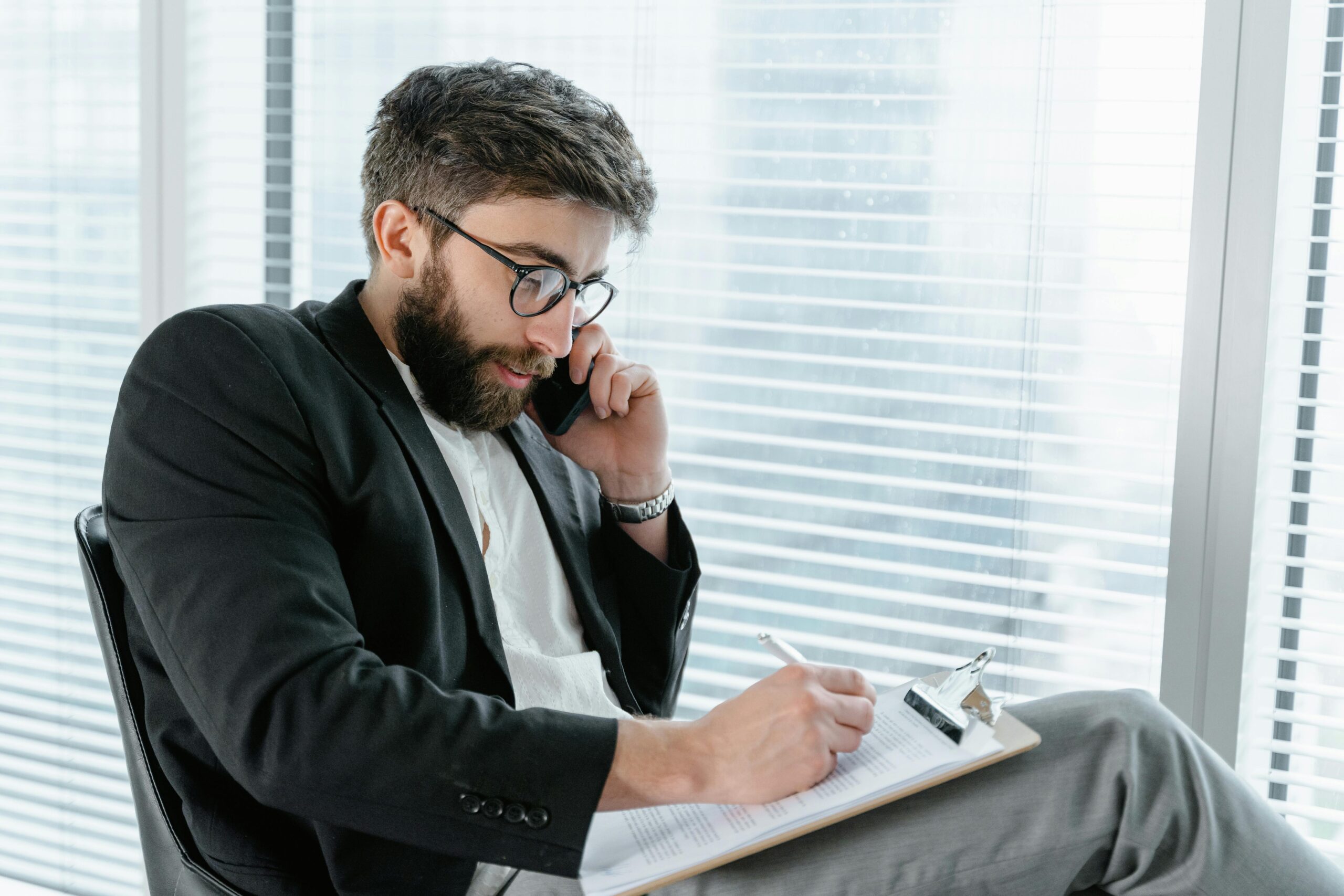A business professional reviewing documents for a company name change process in the United Kingdom.