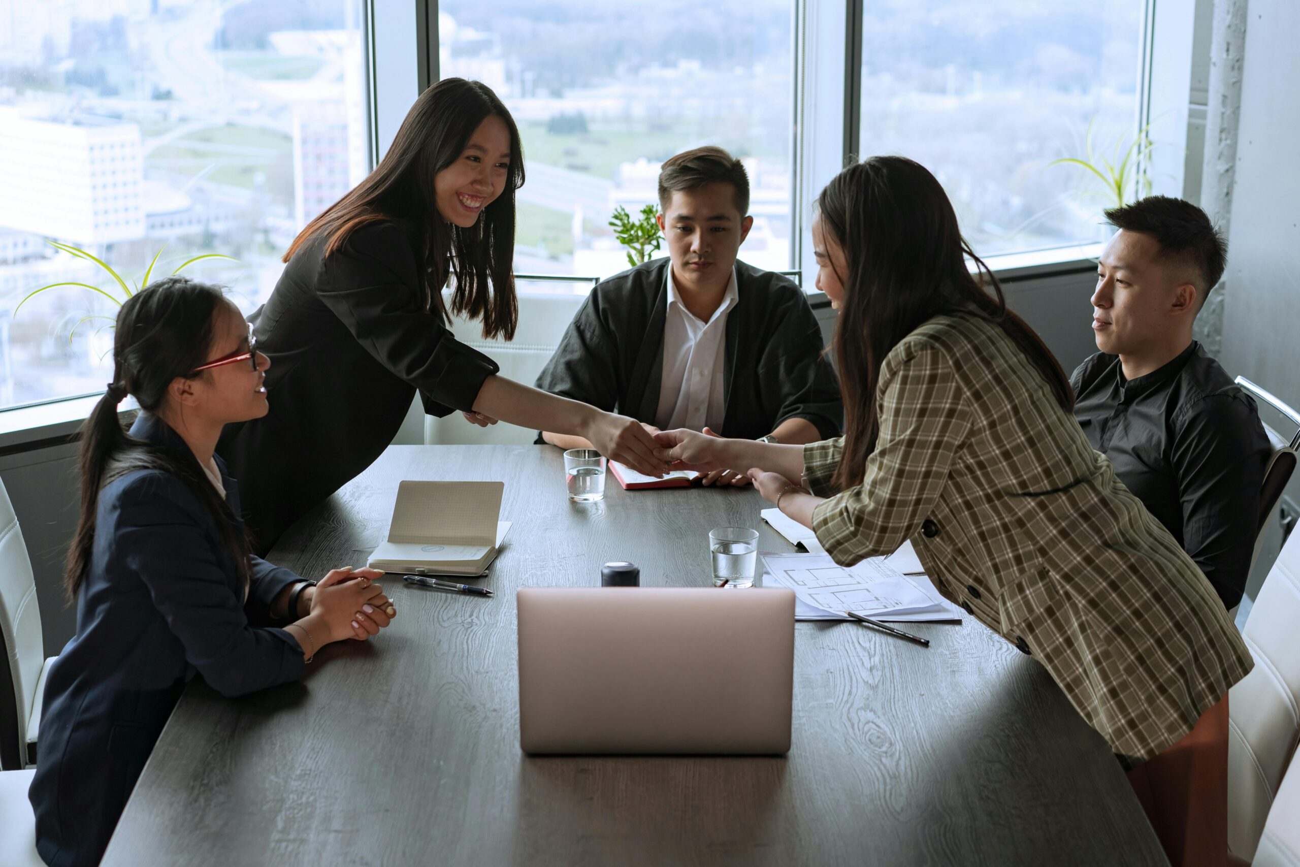 Business professionals attending an annual general meeting in a Hong Kong boardroom