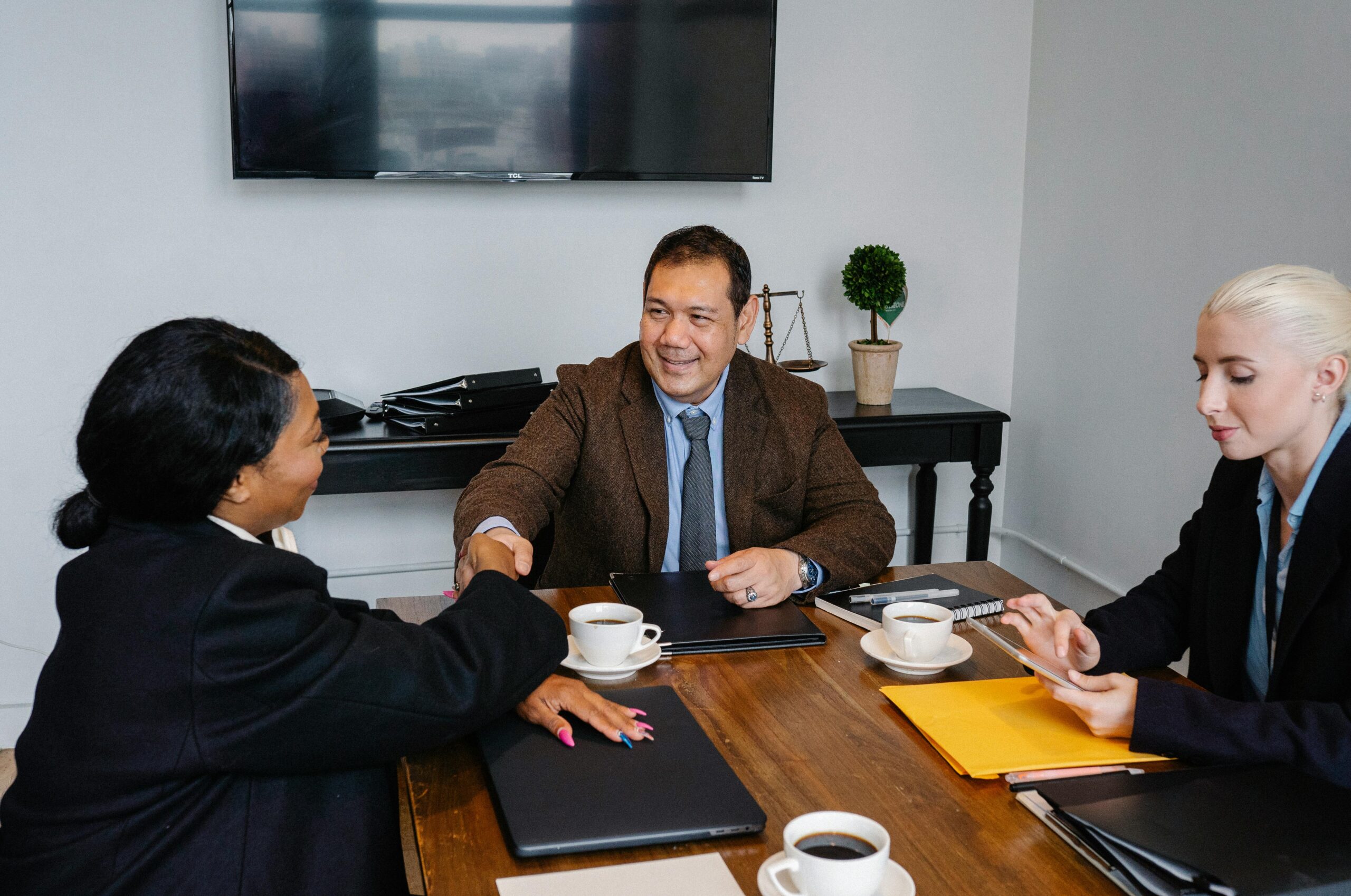 Corporate professionals reviewing shareholder meeting documents for a Panamanian corporation.